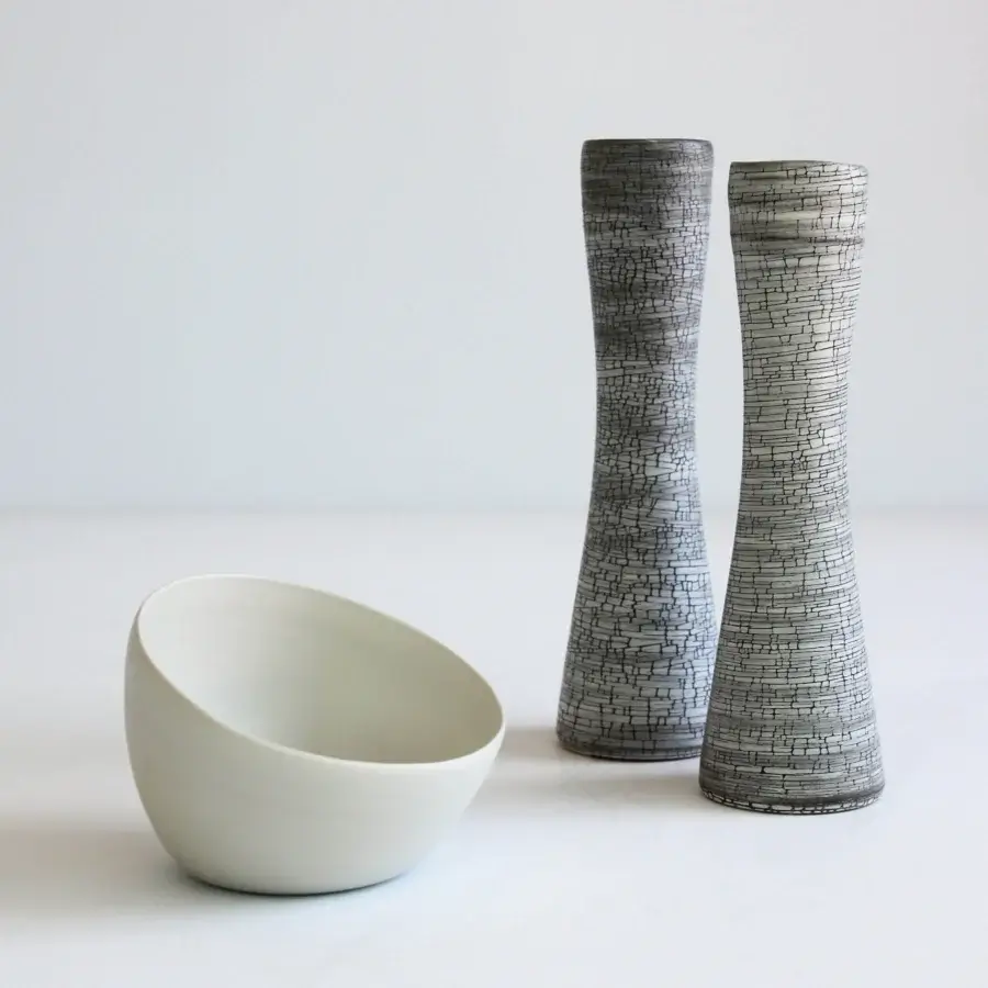 Exclusive Rina Menardi Nidi vase crafted in ceramic with linear dark gray and white patterns and matte finish