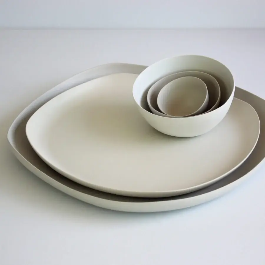 Distinguished Rina Menardi Nidi vase crafted in ceramic with pale off-white tone and smooth matte finish