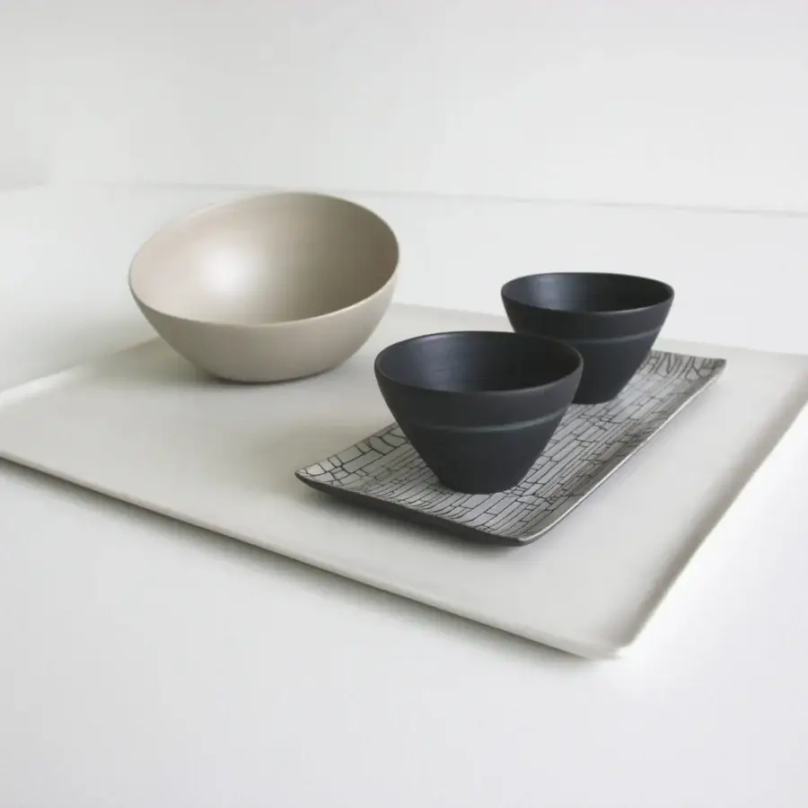 Superior Rina Menardi Nidi vase crafted in Italy with an organic rounded form and matte light beige ceramic