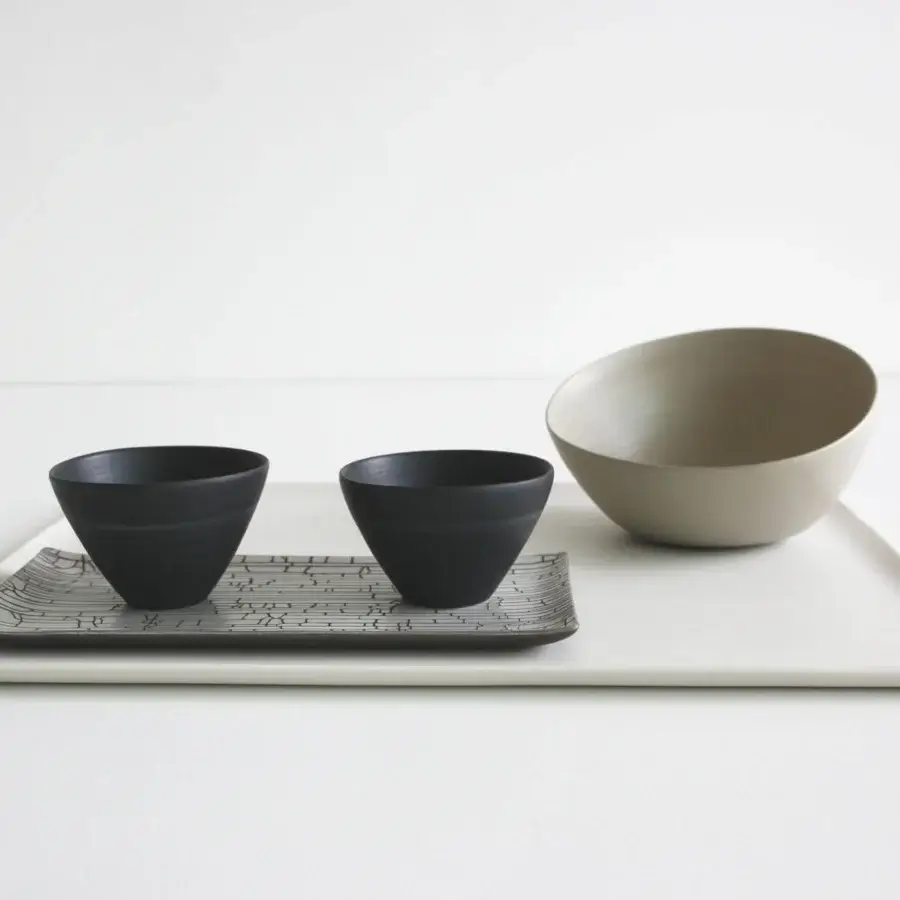 Distinguished Rina Menardi Nidi vase crafted in Italy with a smooth matte finish and deep charcoal ceramic composition