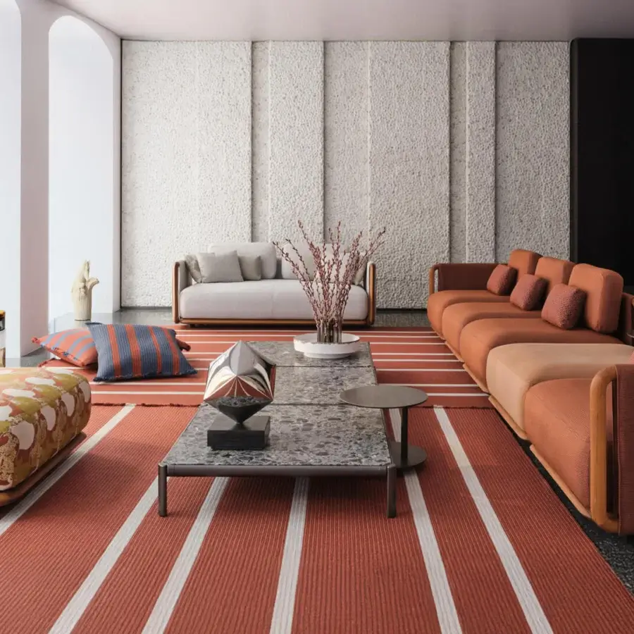 Distinguished Giorgetti Moorea ottoman with terracotta orange floral fabric upholstery and pewter painter stainless steel frame