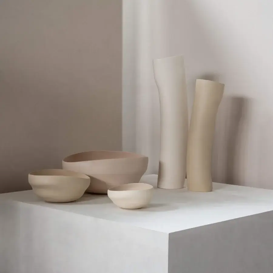 Exceptional Rina Menardi Noci vase exhibiting organic lines in smooth matte pale beige ceramic crafted in Italy