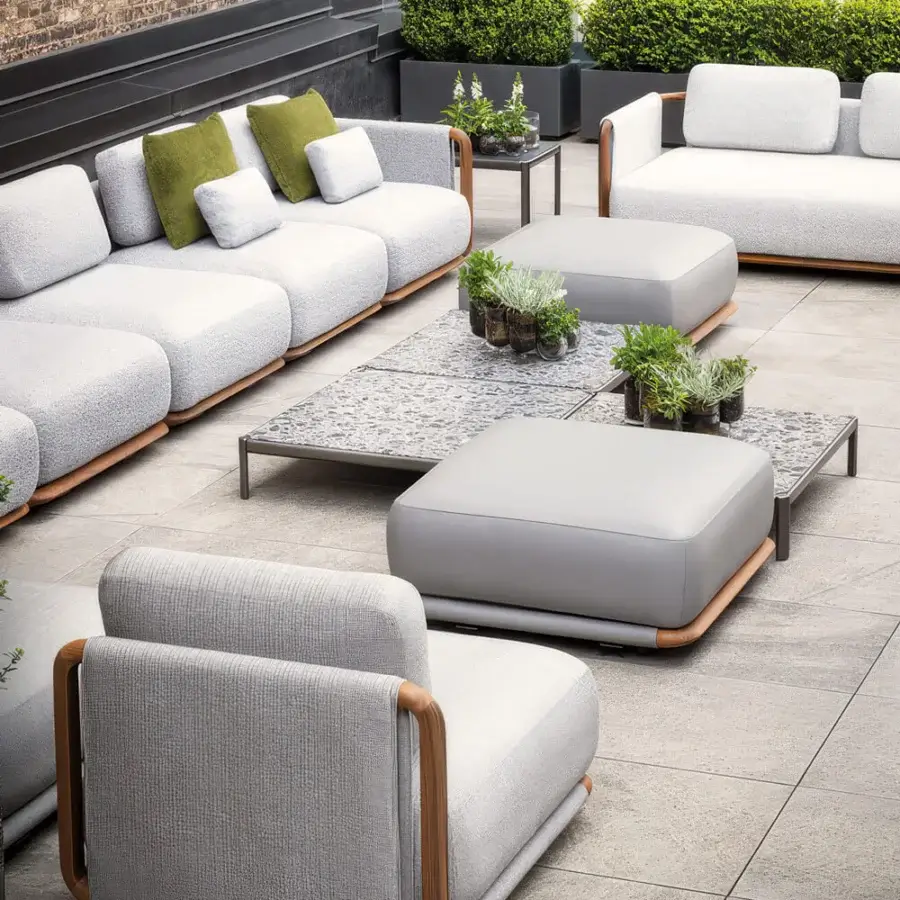Distinguished Giorgetti Moorea lounge chair with pewter-painted stainless steel and painted teak, woven light gray upholstery
