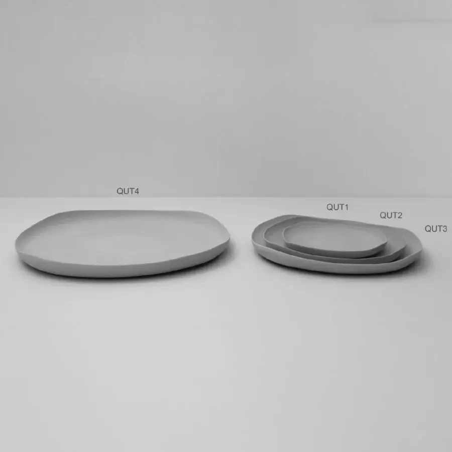 Distinguished Rina Menardi Quadritondi centerpiece crafted in Italy with organically shaped ceramic dishes and a contemporary light gray finish