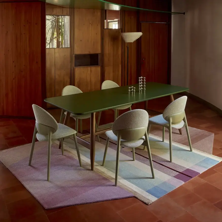 Refined Billiani Fleuron dining chair with sage green upholstery and a meticulously built metal frame showcasing woodworking detail