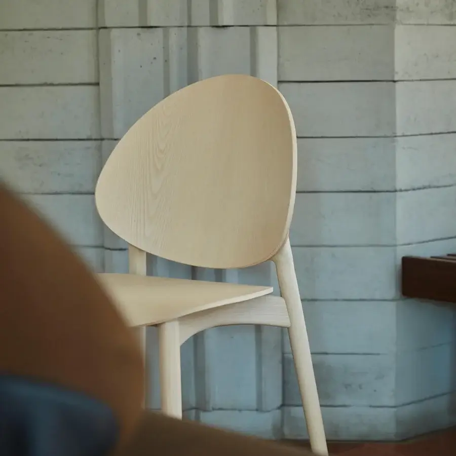 Distinctive Billiani Fleuron dining chair in light-colored wood with a smooth satin finish and petal-like backrest