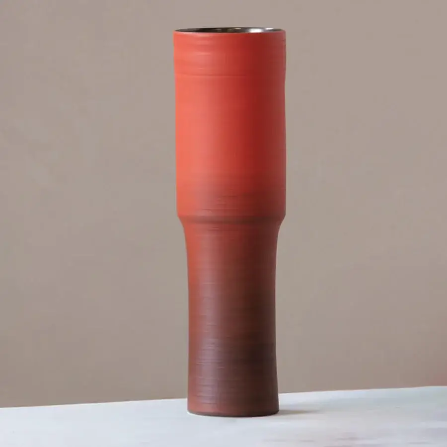 Exclusive Rina Menardi Totem vase crafted in ceramic with a gradient from reddish-brown to orange-red and a matte finish