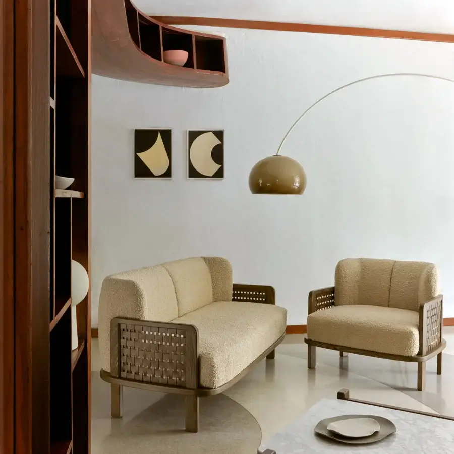 Sophisticated Billiani Raquette lounge chair with warm beige boucle textile and satin finished hardwood frame