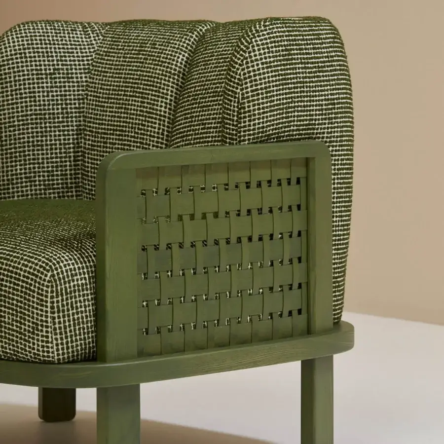 Distinguished Billiani Raquette lounge chair with gently curved form and woven darker green textile in satin-finish olive wood