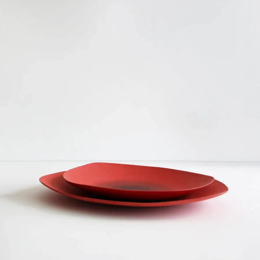 Exceptional Rina Menardi Triangolo centerpiece, a set of two geometrically-inspired serving dishes crafted in Italy with a matte finish