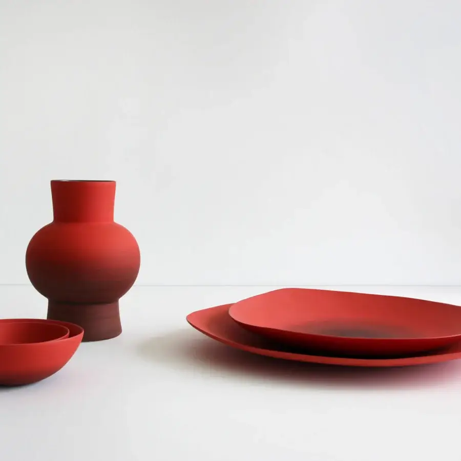 Superior Rina Menardi Triangolo centerpiece, a collection of handmade tableware in reddish-brown with a matte finish