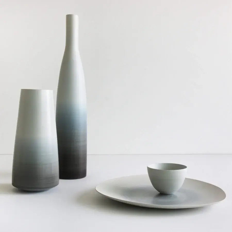 Distinguished Rina Menardi Triangolo centerpiece, a handcrafted decorative accent in pale gray ceramic with a matte finish