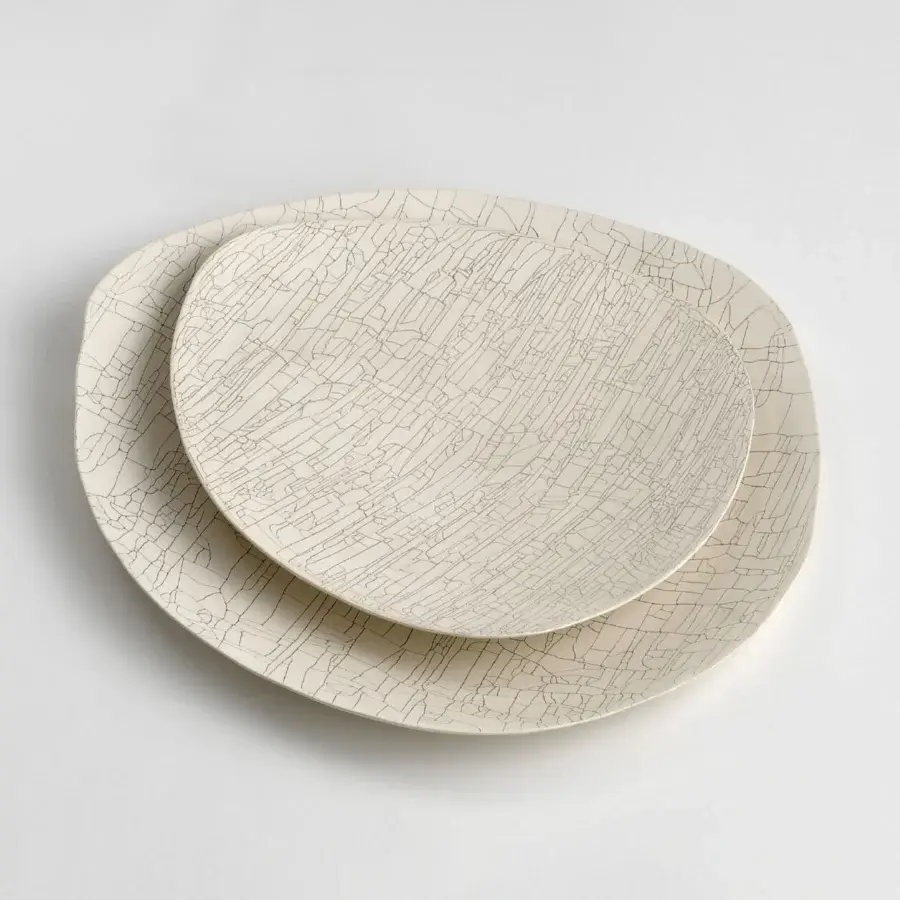 Superior Rina Menardi Triangolo centerpiece, a handmade ceramic accent with incised linear patterns and matte finish
