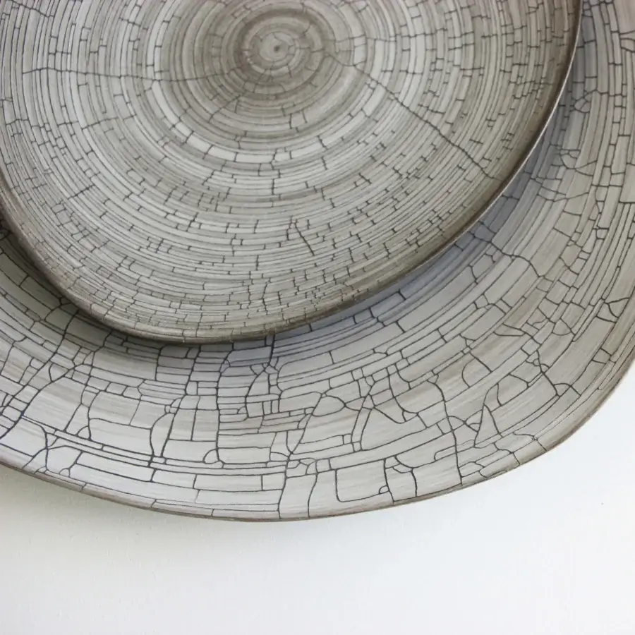 Exceptional Rina Menardi Triangolo centerpiece, a handmade ceramic display with cracked glaze and tonal gradient