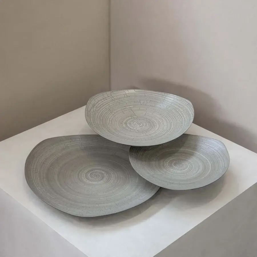 Exceptional Rina Menardi Triangolo centerpiece, a skilled Italian arrangement in matte gray ceramic with incised lines