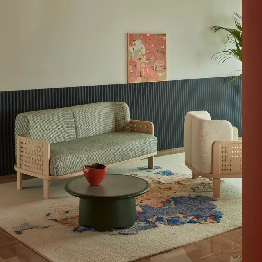 Exceptional Billiani Raquette sofa crafted in Italy with sage green textured textile and woven side panels with a natural wood finish