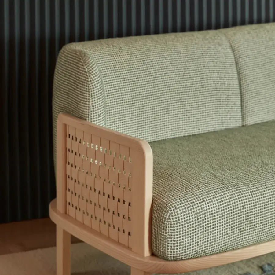 Distinguished Billiani Raquette sofa crafted in Italy with olive green textured upholstery and wooden armrests featuring vertical slat detail