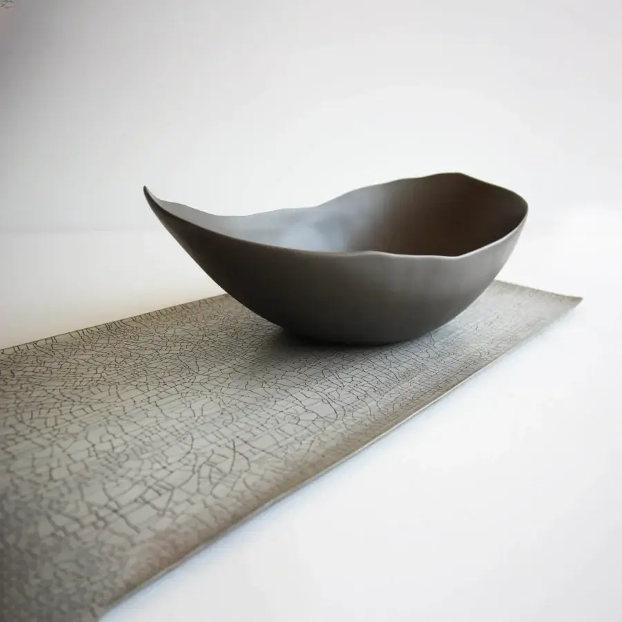 Distinguished Rina Menardi Vassoi Rettangolari centerpiece tray crafted in muted gray-brown with a textured matte finish