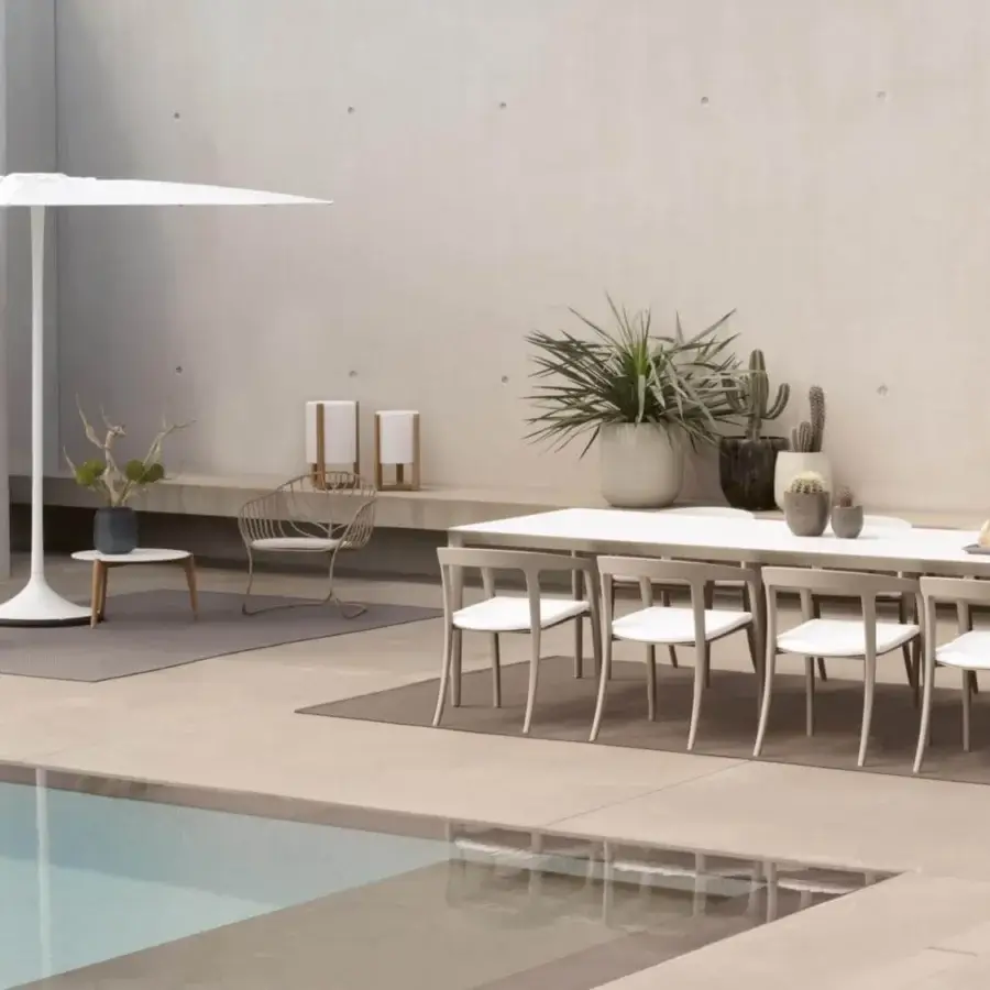 Elegant Royal Botania U-nite table with teak base and top presenting a smooth, neutral-toned matte finish