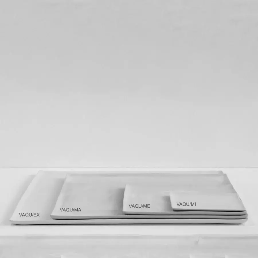Luxury Rina Menardi Vassoi Quadrati centerpiece tray crafted in matte grey composite with tonal variations