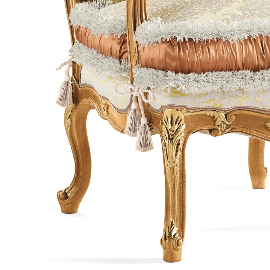 Lavish Riva Mobili D'Arte 6823 lounge chair built with golden wood, ornate floral carvings and gold cream patterned textile upholstery