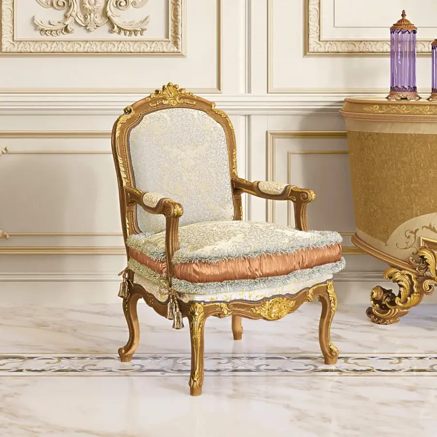 Exquisite Riva Mobili D'Arte 6823 lounge chair crafted with carved wood, cream textile upholstery, golden finish and peach satin trim
