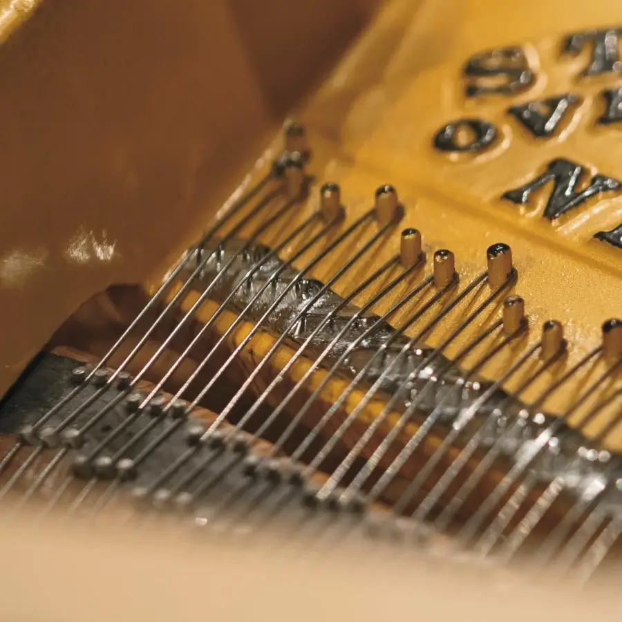 Exceptional Riva Mobili D'Arte 19800 piano built with richly grained wood and glossy finish in warm golden-yellow with silver-grey steel strings