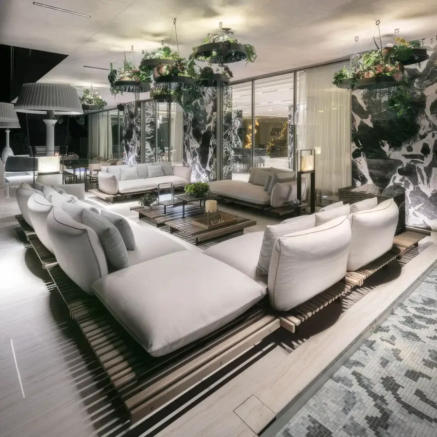 Sophisticated Giorgetti Apsara sectional with carob powder-coated aluminum and Afrormosia wooden slats, built in waterproof neutral fabric