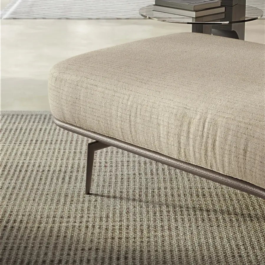 Architectural Carpanelli Sirio sectional in neutral beige textile with stitched leather detailing and matte metal legs