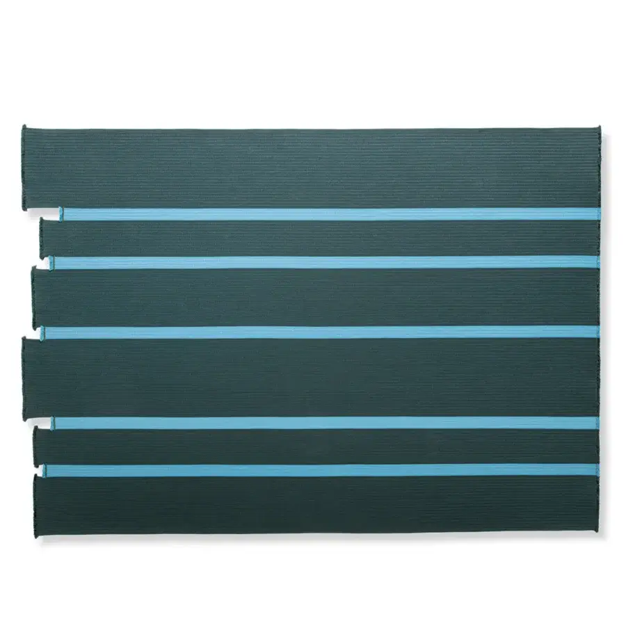 Exceptional Giorgetti Nisida rug crafted with braids in muted teal and brighter blue polypropylene yarn with fringe detail