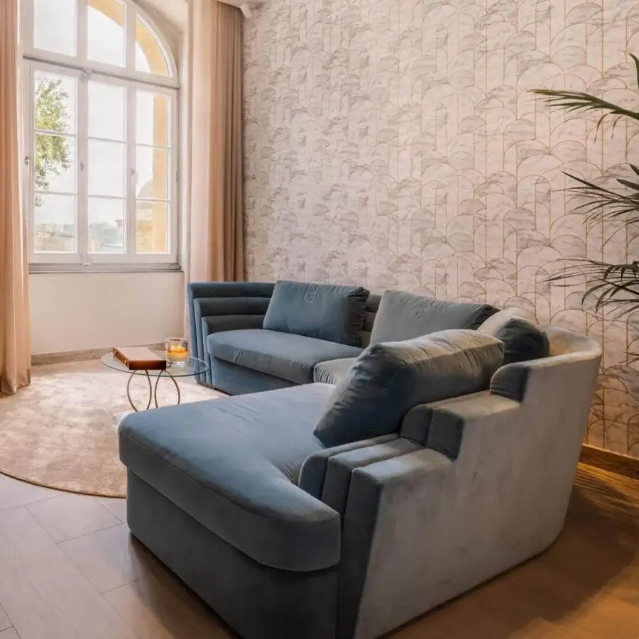 Sophisticated Carpanelli Theater sectional with plush textile upholstery and refined metal base construction