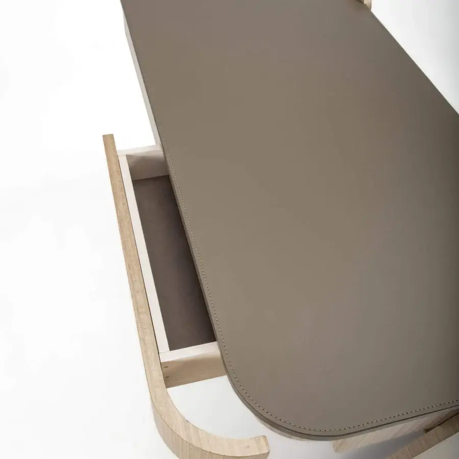 Sophisticated Carpanelli Shape desk crafted in curved eucalyptus wood with a refined taupe leather top and subtle stitching details
