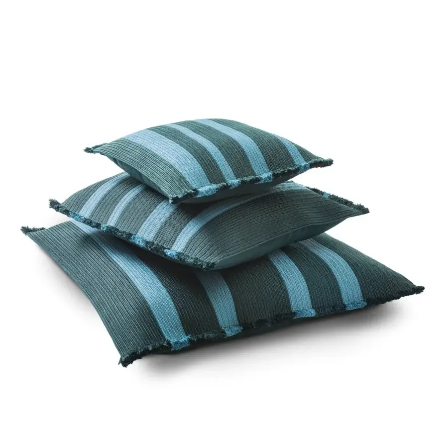Superior Giorgetti Nisida cushion crafted with braided polypropylene in muted teal and lighter blue with casually frayed edges