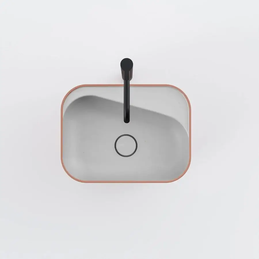 Architectural Norah Design ANCN 01 sink sculpted from muted peach Norahcryl and dark grey with a matte finish