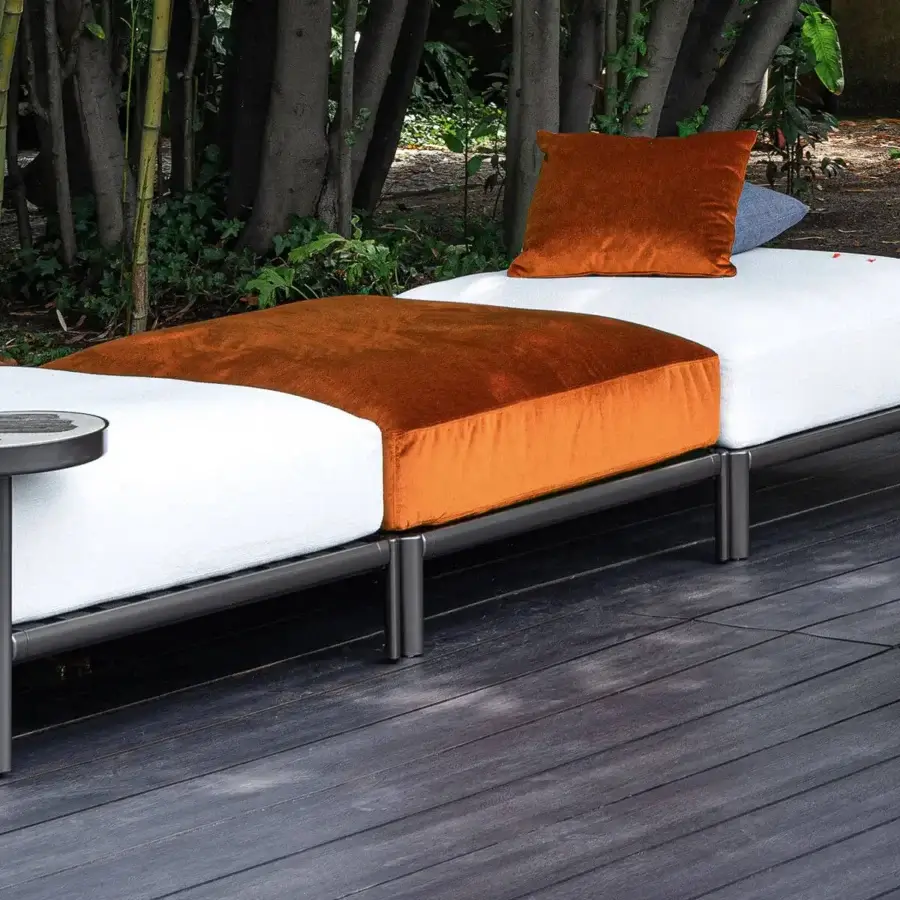 Sophisticated Giorgetti Aldìa ottoman with painted metal frame, waterproof white fabric and vibrant orange velvet cushions