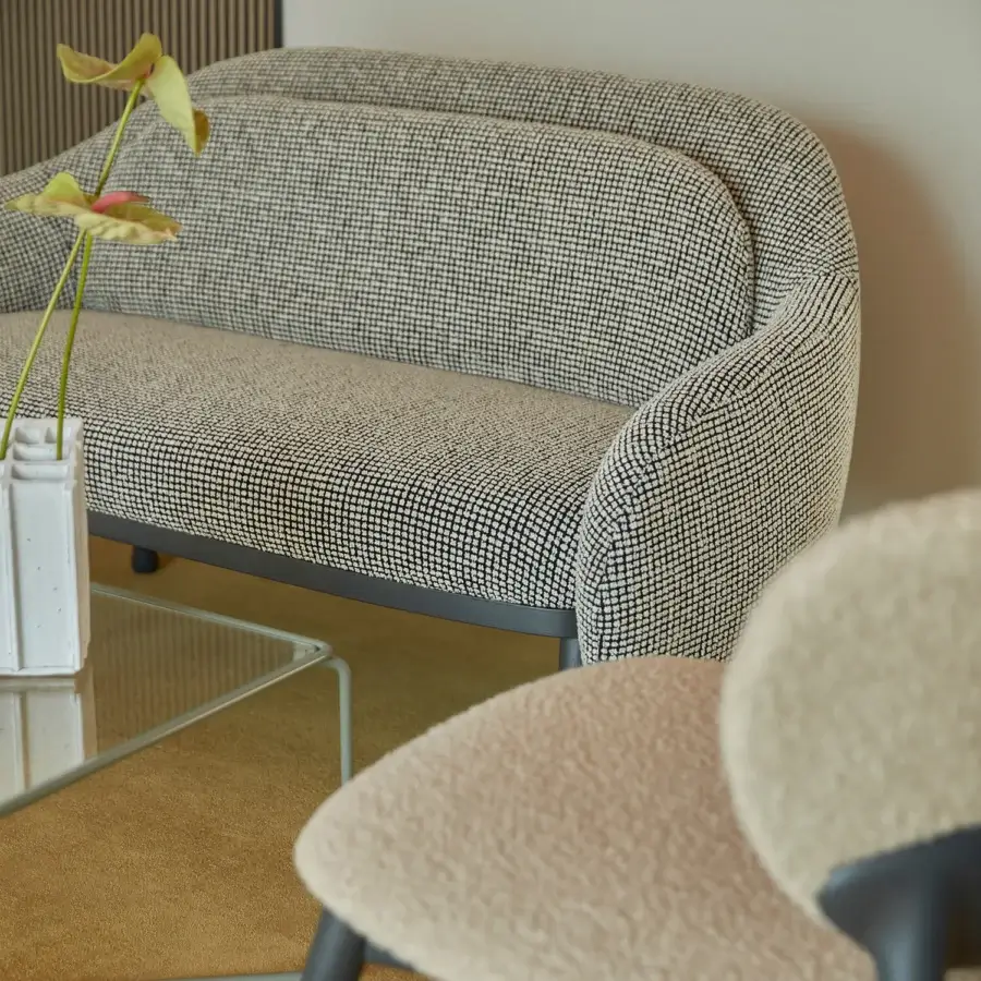 Distinguished Billiani Corolla sofa crafted in neutral beige textile with black speckles and a dark-toned wooden base