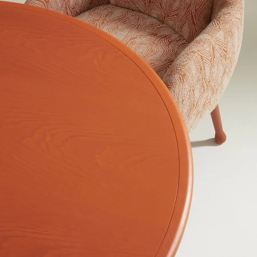 Captivating Billiani Corolla dining table crafted in orange wood with a smooth matte finish and curved silhouette