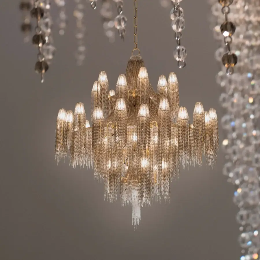 Lavish Patrizia Garganti Burlesque EX XL chandelier with golden-toned metal and cascading clear crystals creates brilliance