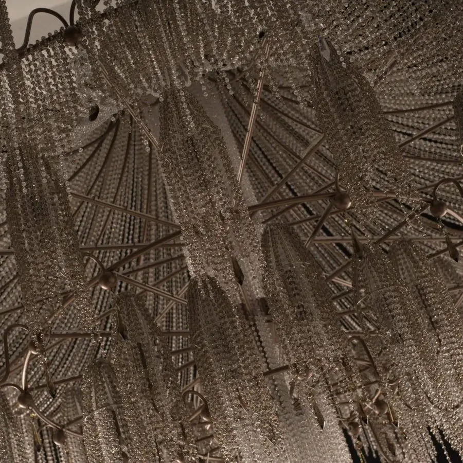 Lavish Patrizia Garganti Burlesque EX XL chandelier with a dark-toned metal framework and cascading transparent glass beads