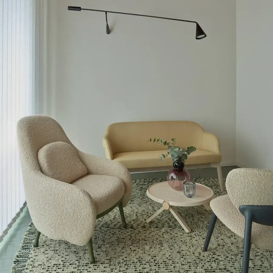 Exceptional Billiani Corolla lounge chair in creamy beige bouclé textile with muted green metal base and textured matte finish