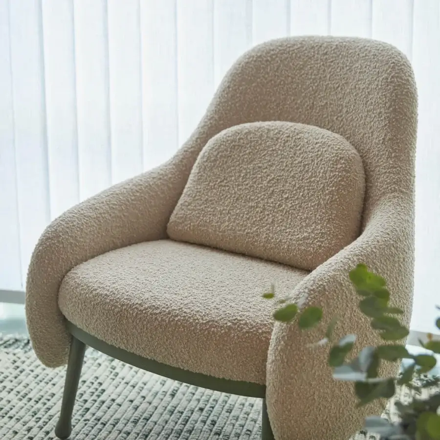 Superior Billiani Corolla lounge chair with enveloping form and textured looped weave upholstery in neutral beige with worked wood base