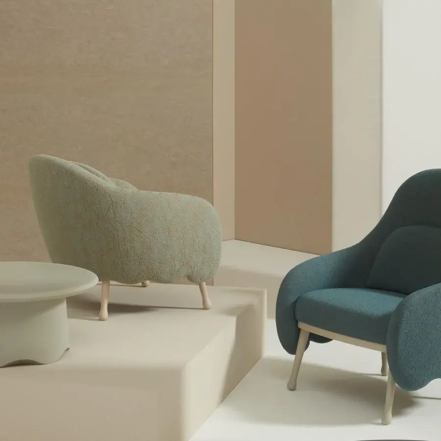Sophisticated Billiani Corolla lounge chair with subtly textured teal textile upholstery and light-colored wood legs