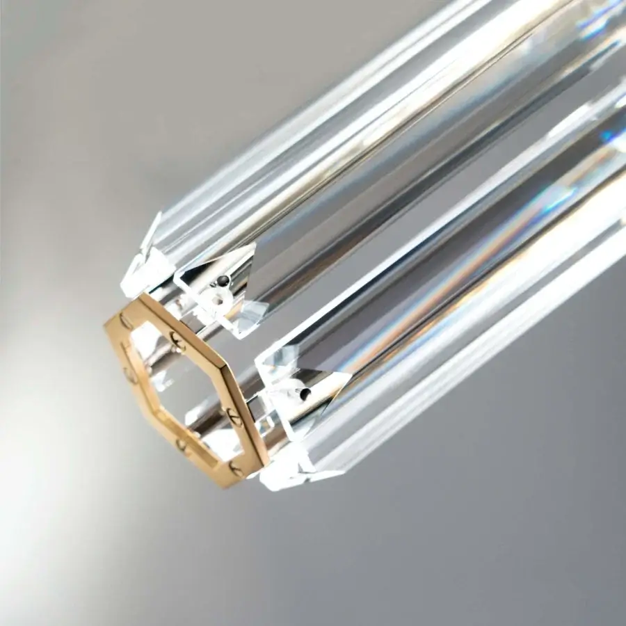 Elegant Patrizia Garganti Chaos Orb chandelier with transparent core encased in polished gold-toned brass hexagonal frame