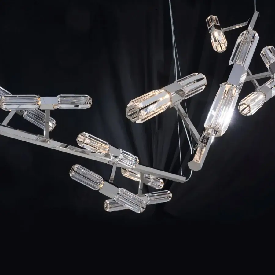 Elegant Patrizia Garganti Chaos 03 chandelier crafted in polished metal with clear glass emitting a warm white glow