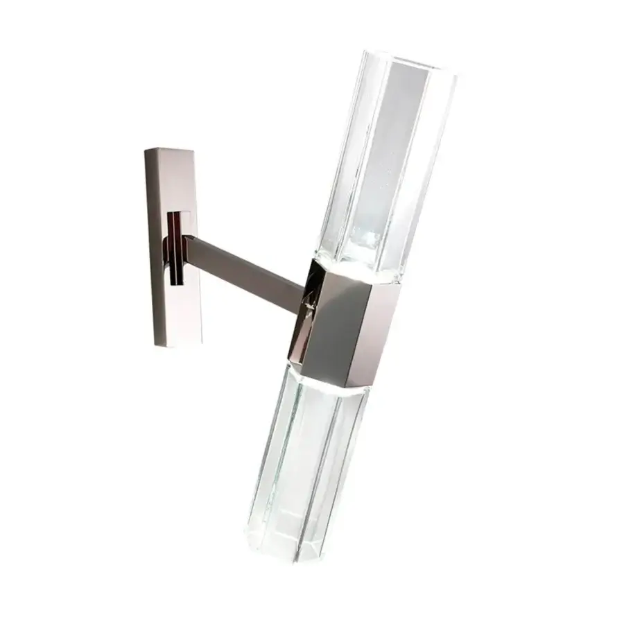 Elegant Patrizia Garganti Chaos wall lamp with polished metal and transparent faceted glass emitting warm white illumination