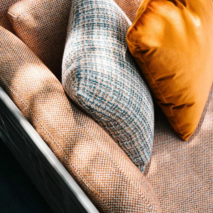 Sophisticated Giorgetti Aldìa sectional with warm orange fabric upholstery and a pewter painted metal structure