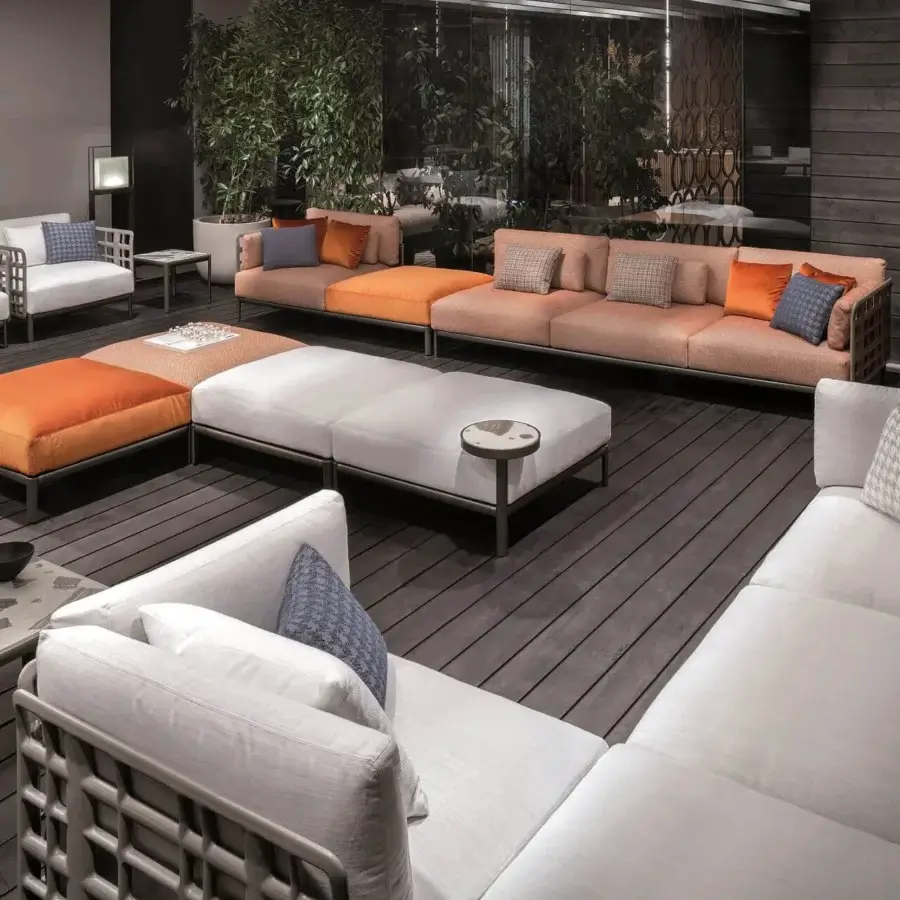 Distinguished Giorgetti Aldìa sectional with a pewter-finished metal structure and reconstituted birch plywood backrests crafted in neutral peach, orange, and white tones