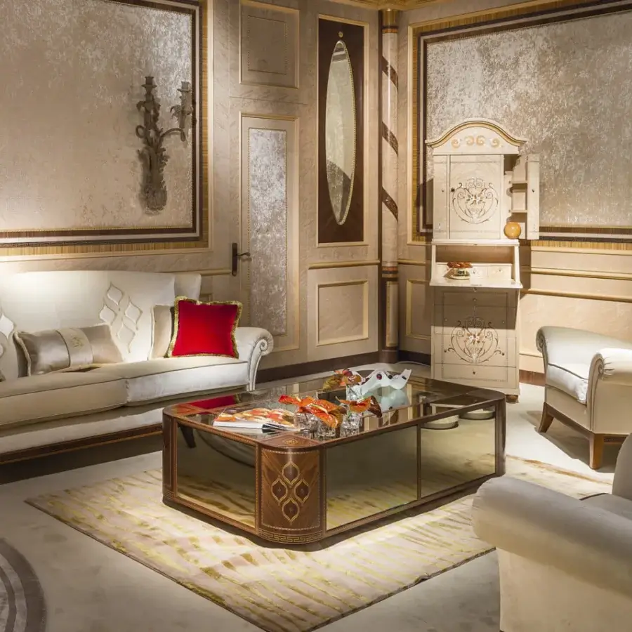 Distinguished Carpanelli Arts sofa upholstered in cream textile with gold thread embroidery and a central leather panel with red cushions
