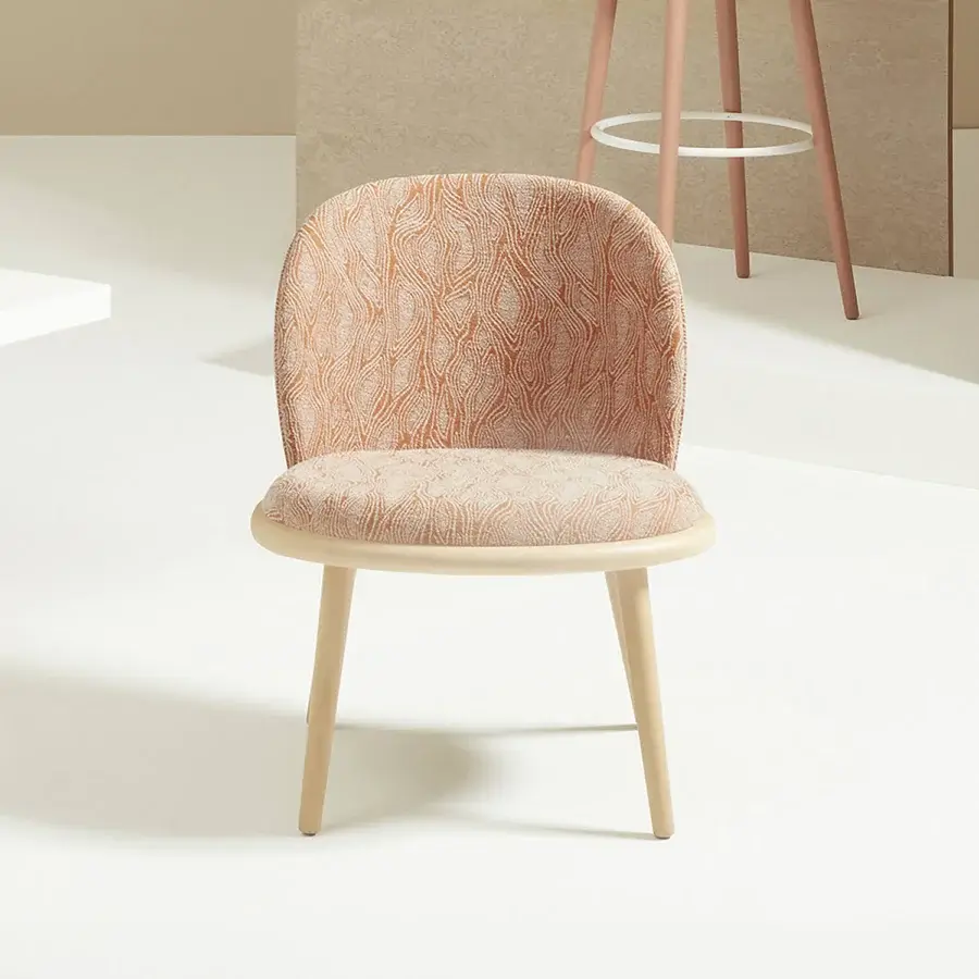 Distinguished Billiani Veretta lounge chair crafted with a curved solid beechwood ring and warm orange patterned textile with a satin finish