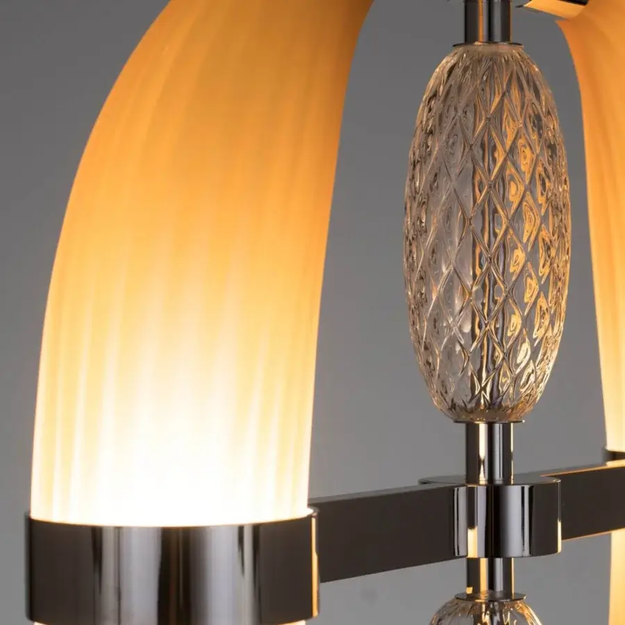 Elegant Patrizia Garganti Coup De Foudre 02 suspension lamp with hand-blown glass and brushed modular metal structure creating a warm amber glow